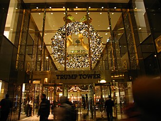 The Trump Tower on Fifth Avenue, main entrance with Christmas decoration, Manhattan, New York City (2011) via Wikimedia Commons