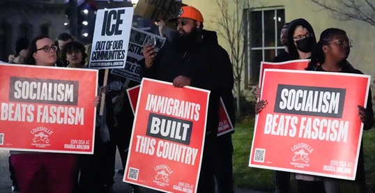 democratic socialist signs at ICE protest